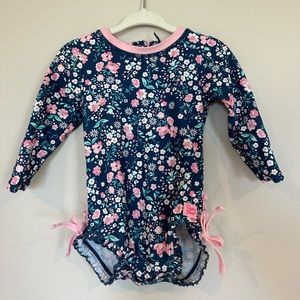 Rufflebutt Pink Polka Dot One Piece Rash Guard
Size 12-18 months